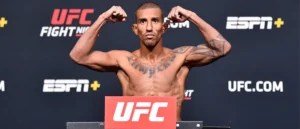 A fighter flexes his muscles at a UFC weigh-in event.