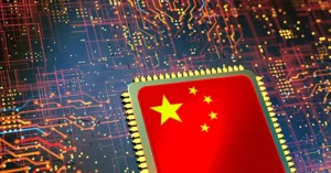 The image depicts a semiconductor chip with the Chinese flag, symbolizing China's advancements in technology and semiconductor manufacturing.