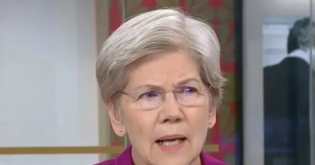 The image shows a person wearing glasses and a pink top, speaking in what appears to be a formal or professional setting.