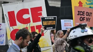 Protesters hold signs calling for the release of information and the abolition of ICE in New York City.