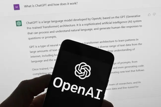 The image shows a smartphone displaying the OpenAI logo, with a background text explaining ChatGPT, a large language model developed by OpenAI.