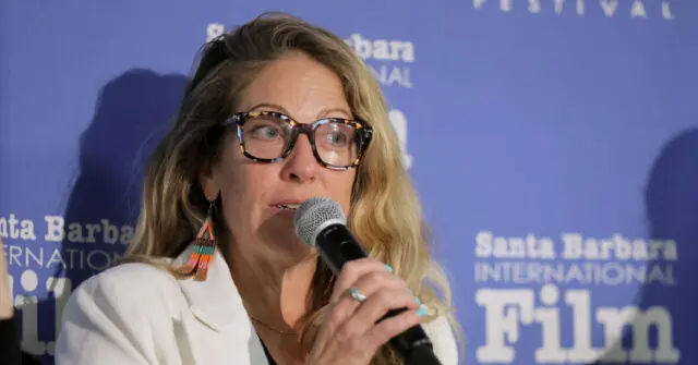A woman speaks into a microphone at the Santa Barbara International Film Festival.