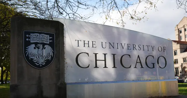 The image shows a sign for The University of Chicago, featuring the university's emblem and motto.