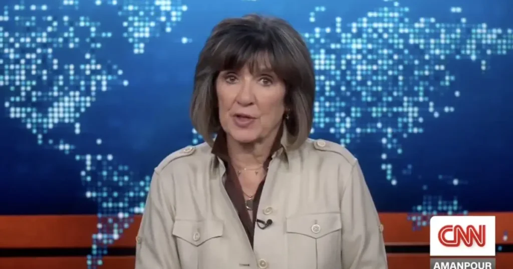 A news anchor is speaking on a CNN broadcast, with a world map in the background.