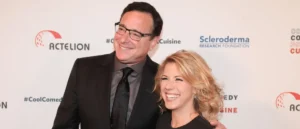 The photo shows two individuals posing together at an event sponsored by Actelion and the Scleroderma Research Foundation.