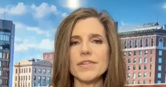 The news photo features a person with long hair in front of a cityscape background.