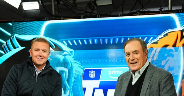 Two individuals are posing in front of a vibrant NFL and Amazon Prime logo backdrop.