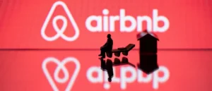 The image depicts a miniature figure sitting on a bench in front of the Airbnb logo, symbolizing a person's connection to the platform.