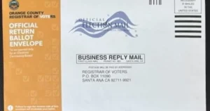 The image shows an official return ballot envelope from the Orange County Registrar of Voters, designed for mail-in voting.