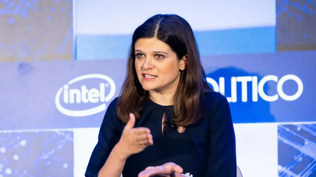 A woman is speaking at a POLITICO event, with an Intel logo visible in the background.