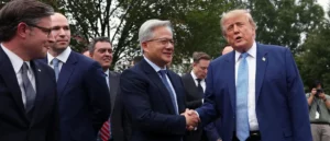 The photo shows a group of men in suits shaking hands outdoors, with one man in a blue suit and tie appearing to be the focus of the interaction.