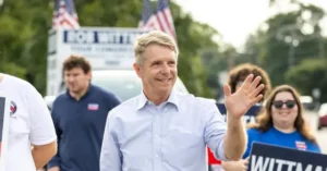 A politician waves to the crowd during a campaign event.