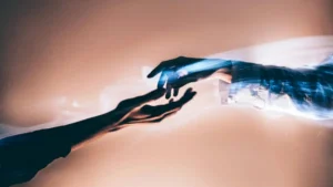 The image depicts a surreal, ethereal scene of two hands reaching towards each other, with one hand appearing to be made of light or energy, symbolizing connection or a spiritual bond.