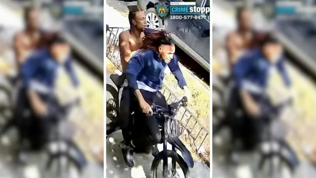 A shirtless man is being chased by a police officer on a bicycle.