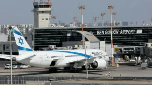 The image shows an El Al airplane parked at Ben Gurion Airport in Israel.