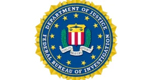 The image shows the seal of the Federal Bureau of Investigation (FBI), which is part of the Department of Justice.