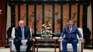 The photo shows two leaders seated in a formal setting, engaging in a diplomatic meeting.