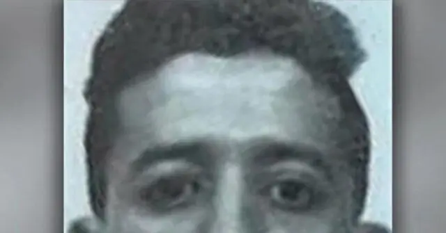 The news photo is a close-up of a person with short, dark hair, captured in a grayscale tone.