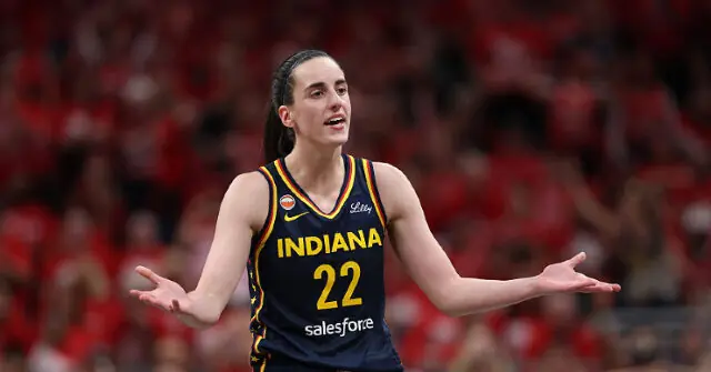 The image shows a basketball player wearing an Indiana jersey with the number 22, celebrating or reacting during a game.