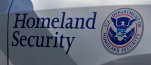 The image shows the logo of the U.S. Department of Homeland Security on a vehicle.