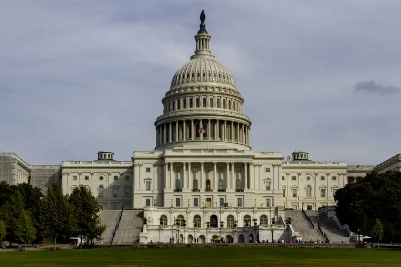 The image shows the United States Capitol building in Washington, D.C., a prominent symbol of American government.
